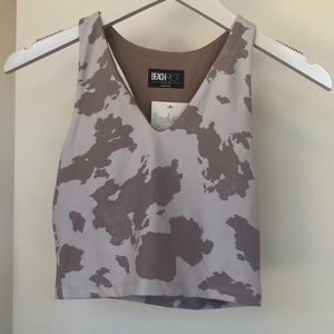 BeachRiot high neck crop top style sports bra with V neck in painted cow print